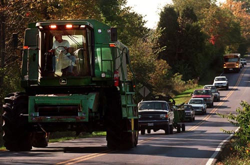 Line of traffic behind a tractor on the highway