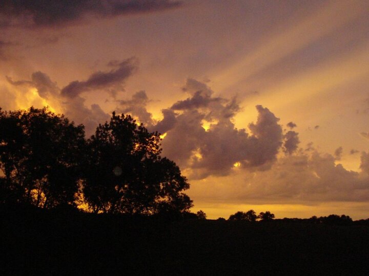 Sun shining through clouds.